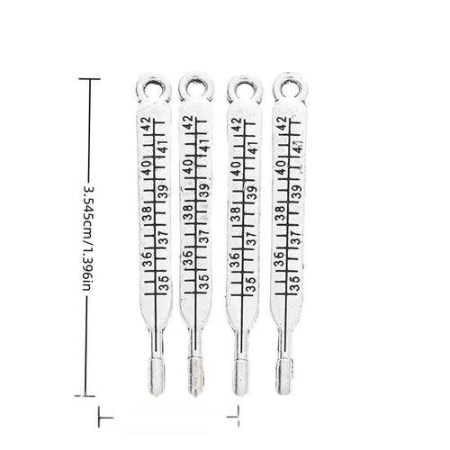 Front-facing arrangement of thermometer charms on a white background