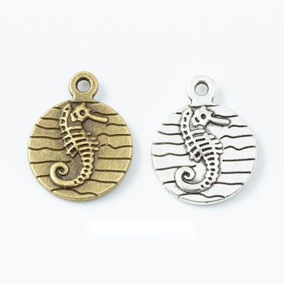 Group view of a raised seahorse appears against horizontal lines inside a round frame