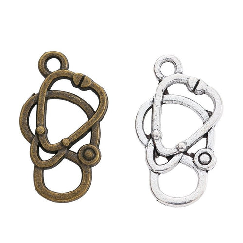 Stethoscope metal charm displaying front and reverse sides