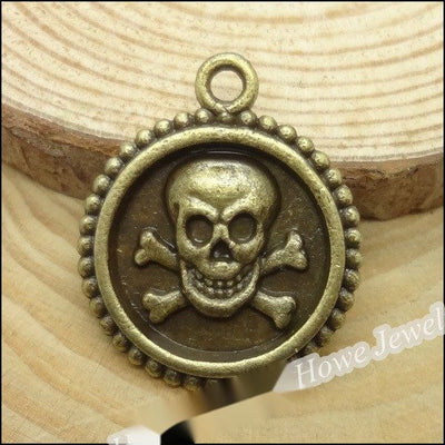 Front and finish comparison of skull medallion charm