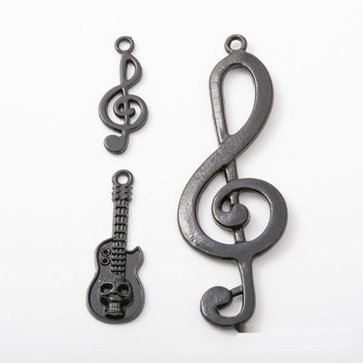 Group view of music charm styles on a white background
