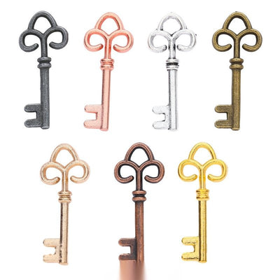 Fleur De Lis Key metal charm displaying front and reverse sides