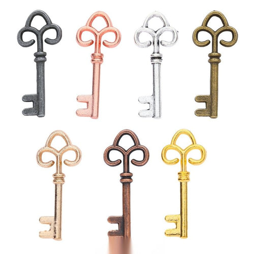 Fleur De Lis Key metal charm displaying front and reverse sides