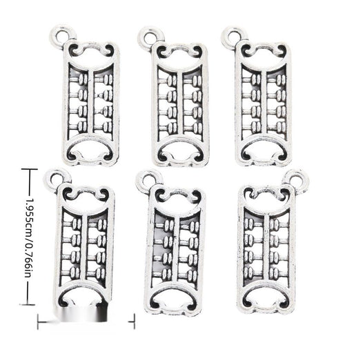 Front and reverse views of long abacus charms with measurement and weight guides