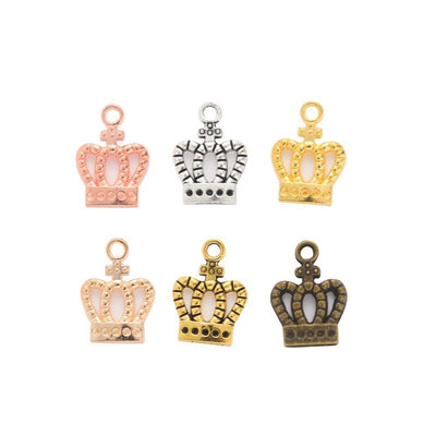 Cutout Royal Crown Metal Charms in Six Finishes in multiple metallic finishes displayed together on a white background.