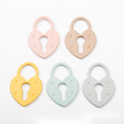 Heart-shaped padlock with a large keyhole cutout shown in the available finishes