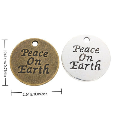 Finish overview of peace on earth round metal charm