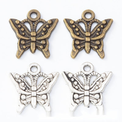 Beaded butterfly metal component, grouped front view on white