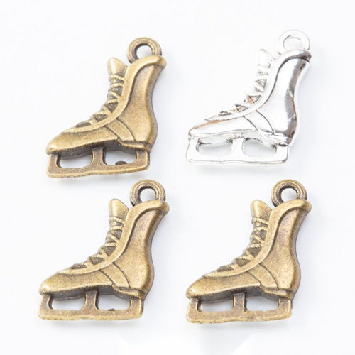 Product photo 1 of the ice skate charm highlighting its lace-up ice skate silhouette with an open blade