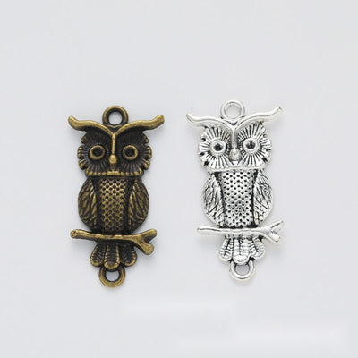 Perched Owl Charm finish comparison on a white background