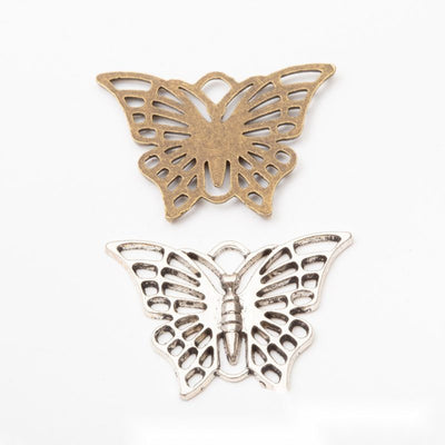 Product photo 1 of the openwork butterfly connector highlighting its wide butterfly with open patterned wings and two lo