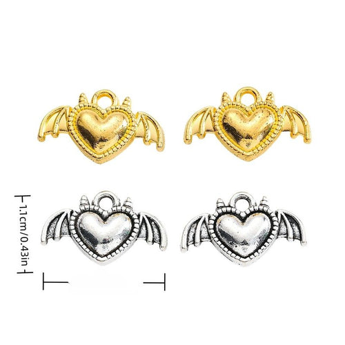 Group view of bat-wing heart charm showing all 2 pictured finish variants