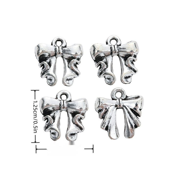 Ornate Bow Detailed Alloy Charm in Antique Silver Finish