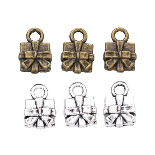 Front-facing arrangement of bow-topped gift box charms on a white background