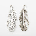 Detailed Long Feather Metal Charm in Antique Silver Finish view 1