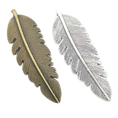 Large feather metal component, grouped front view on white