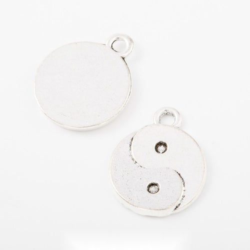Group view of round yin yang charm on a white background