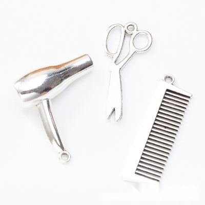 Hairdressing tool metal component, grouped front view on white