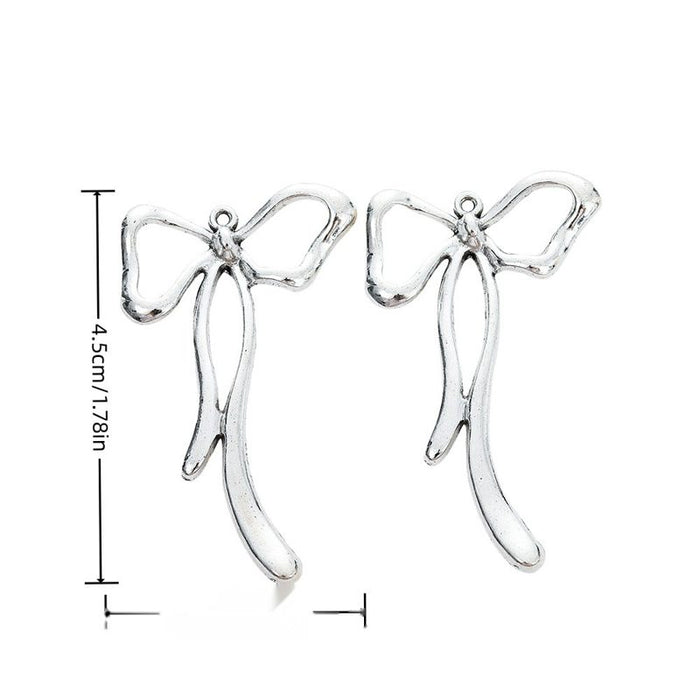 Slender Ribbon Bow Alloy Charm in Antique Silver Finish