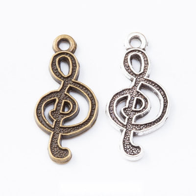 Open treble clef silhouette with dotted reverse texture shown in the available finishes