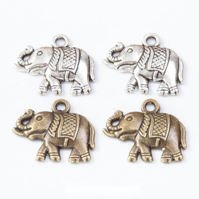 Group view of the walking elephant charm showing the available finishes and front details