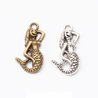 Group view of a seated mermaid silhouette features a curled tail and top hanging loop