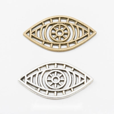 Grouped front view of openwork eye connector charms in the available finishes