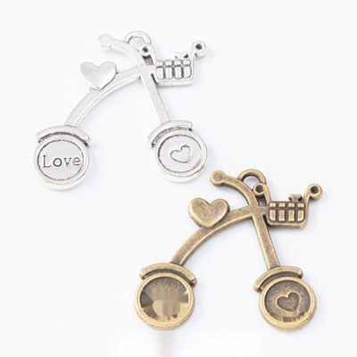 Heart Bicycle Metal Charm Pendant shown in the available visible finishes