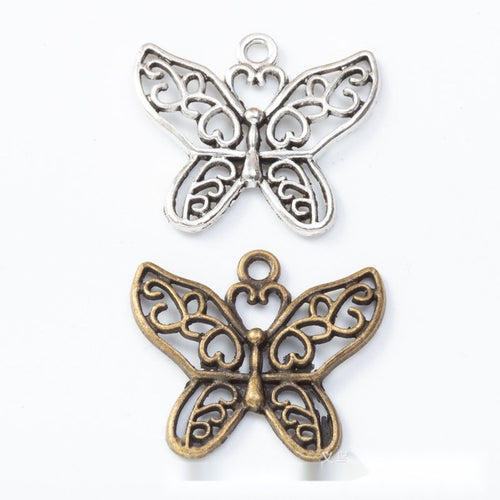 Openwork Floral Butterfly Charm Pendant finish comparison showing scrolling floral cutouts across both wings