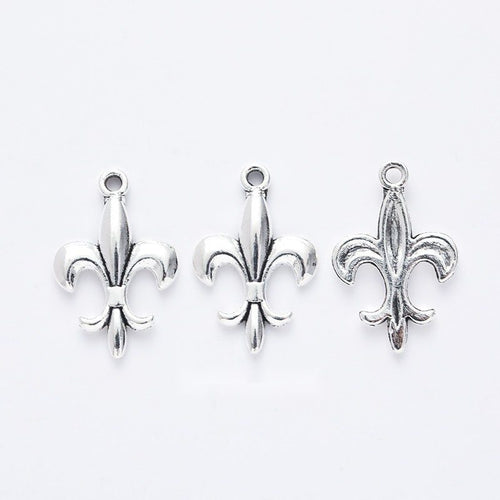 Fleur De Lis Charm shown in all pictured finishes on a white background