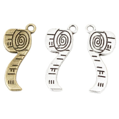 Tape measure charm shown across the available finishes