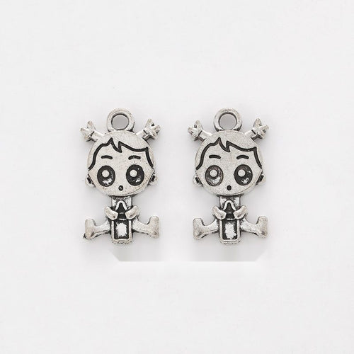 Cartoon Girl Charm shown in the available metal finishes on white