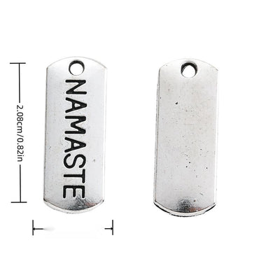 NAMASTE Engraved Rectangular Tag Pendant Charm in Antique shown in front and back product view