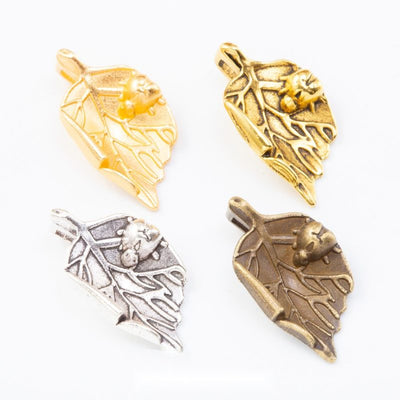 Textured Leaf Metal Charms in Six Vintage Finishes in multiple metallic finishes displayed together on a white backgroun