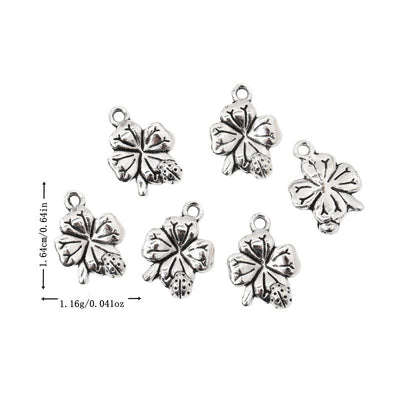 Metal rounded four-leaf clover charm, front and reverse views shown in the product image