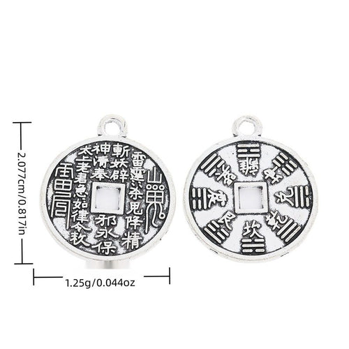 Front and reverse views of yin yang coin charms with measurement and weight guides