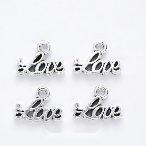 Grouped front views of the script love word charm in available finishes
