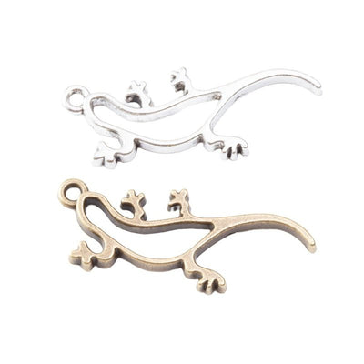 Long lizard-shaped open frames with curled feet and tails arranged together on a white background.