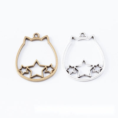 Assorted cat outline open bezels arranged together on a white background