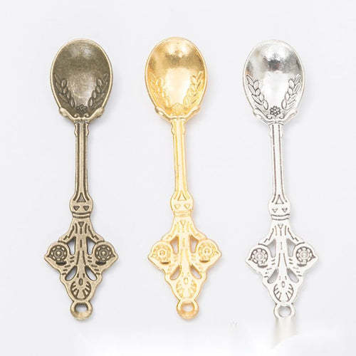 Finish assortment shown together of the ornate miniature spoon charm