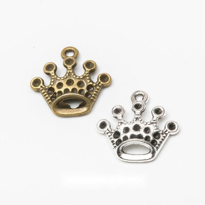 Small crown with rounded tips and pierced dot details shown in the available finishes