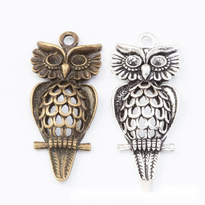 Long Owl Charm finish comparison on a white background