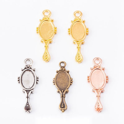 Ornate hand mirror bezel shown across the available finishes