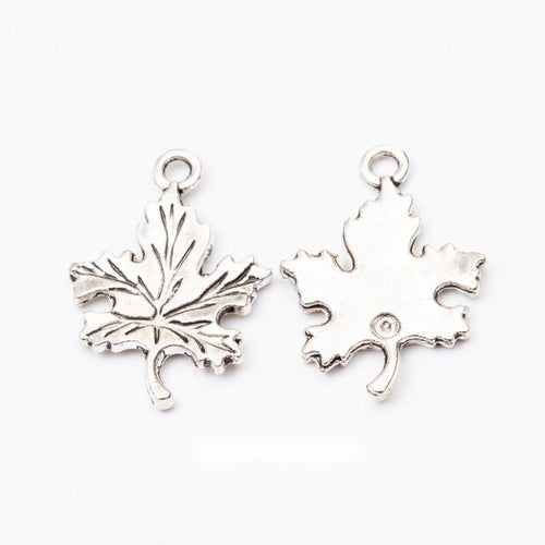 Front comparison of detailed maple leaf metal component in 1 finishes