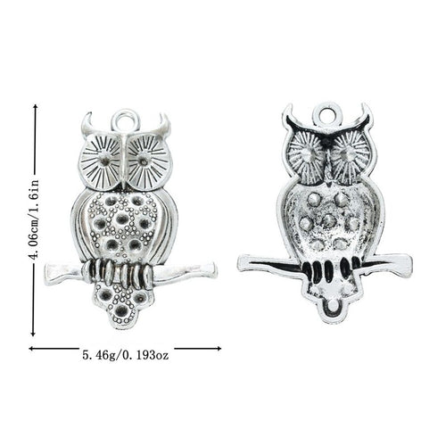 Front view of perched owl charm showing finish variation 1