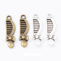Bow Decorated Comb Charm Pendants in 2 Metal Finishes view 1
