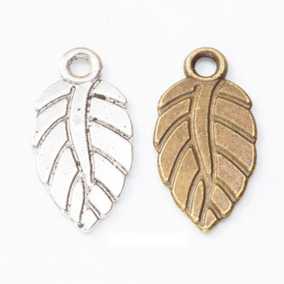 Veined leaf metal component, grouped front view on white