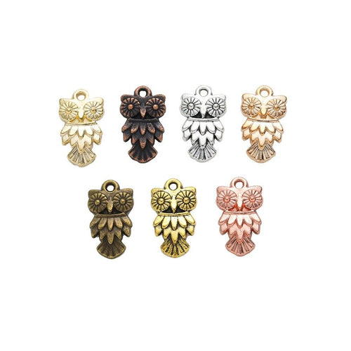 Front comparison of layered owl metal component in 7 finishes