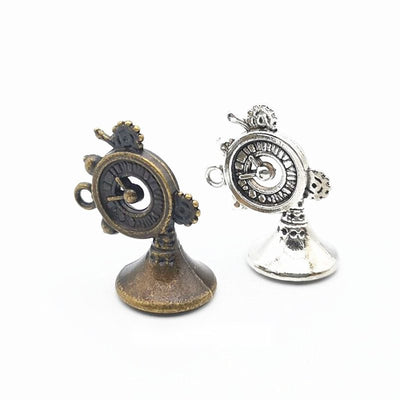 Product view of decorative horn charm showing a compact horn instrument with a flared bell, circular valve detail, and s
