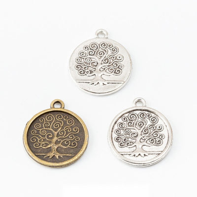 Round Embossed Tree of Life Metal Charms in multiple metallic finishes displayed together on a white background.